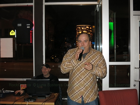 The Rock God singing at Charquis